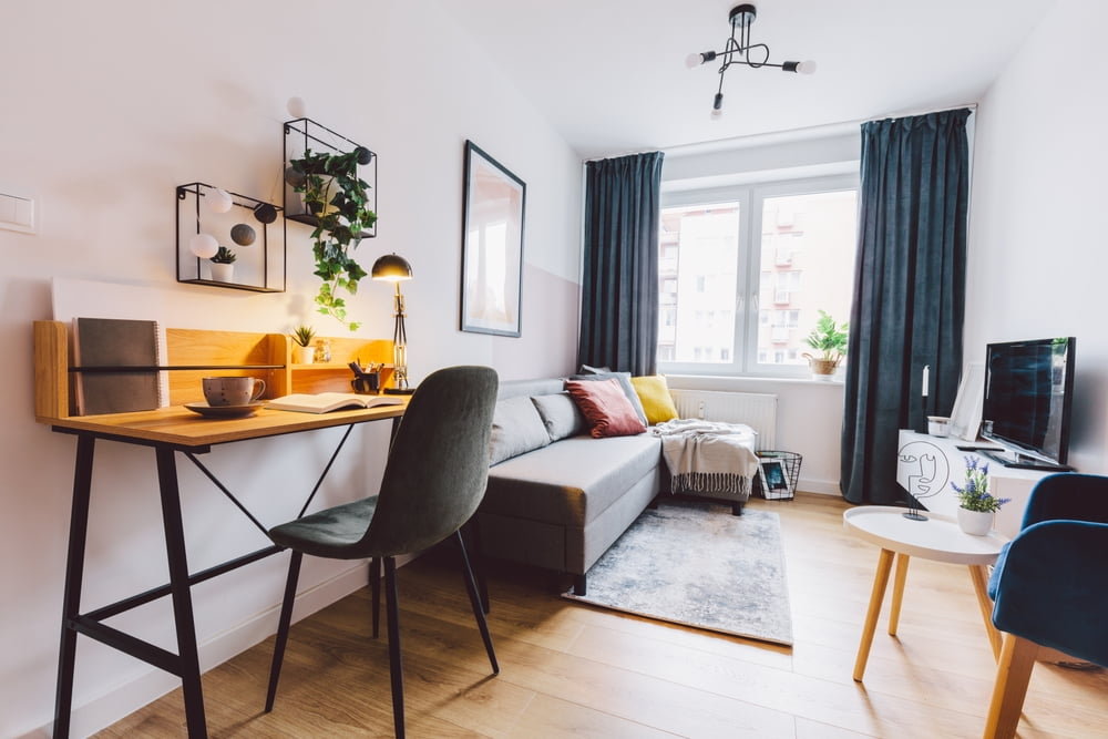 Interior of small apartment living room for home office. A small aesthetic and functional space like the ones made by a construction company in new orleans.