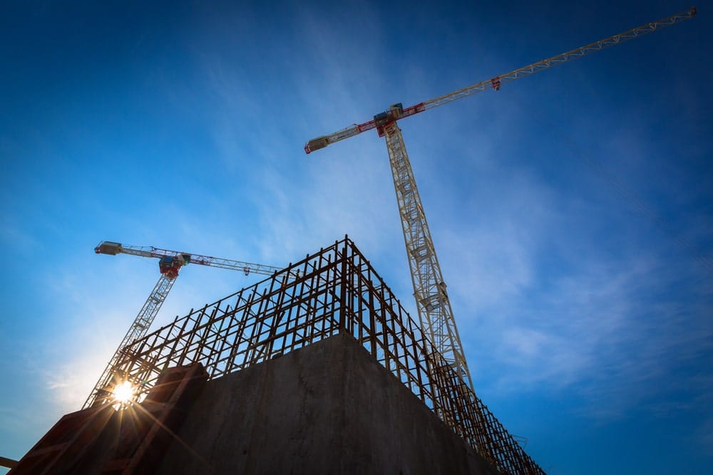 Urban commercial construction site, showcasing modern development amidst the city landscape.