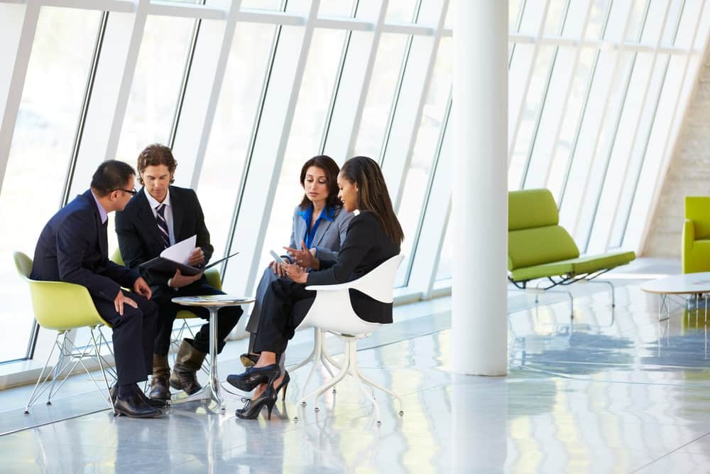 Business Professionals Engaged in a Meeting in a Modern, Innovatively Designed Office Space